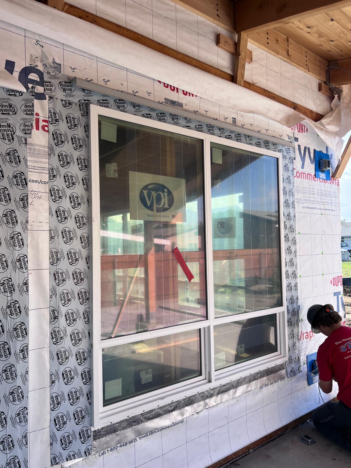 Close-up of vinyl window with Protecto Wrap self-adhered flashing at the head and jambs